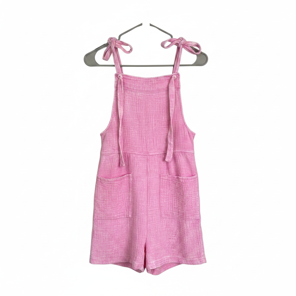 Pink short romper on white background